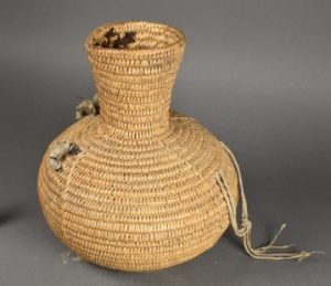 Water jar with pine pitch coated interior. Jicarilla Apache. Museum of Indian Arts and Culture, 23547/12 