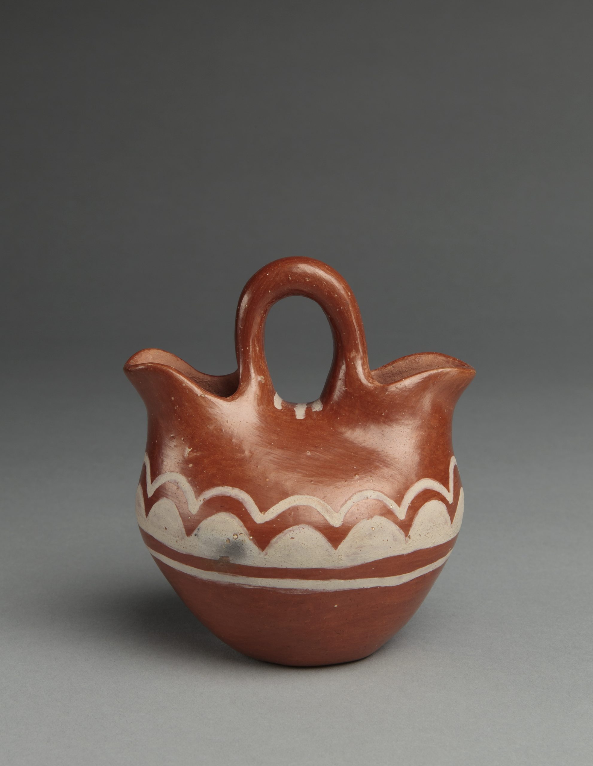 Vase, Dominguita Padilla (Tesuque Pueblo), 1932, clay, paints, 4 ½” x 3 ¾”. Cat. no. IAF.2861. Photo by Addison Doty.