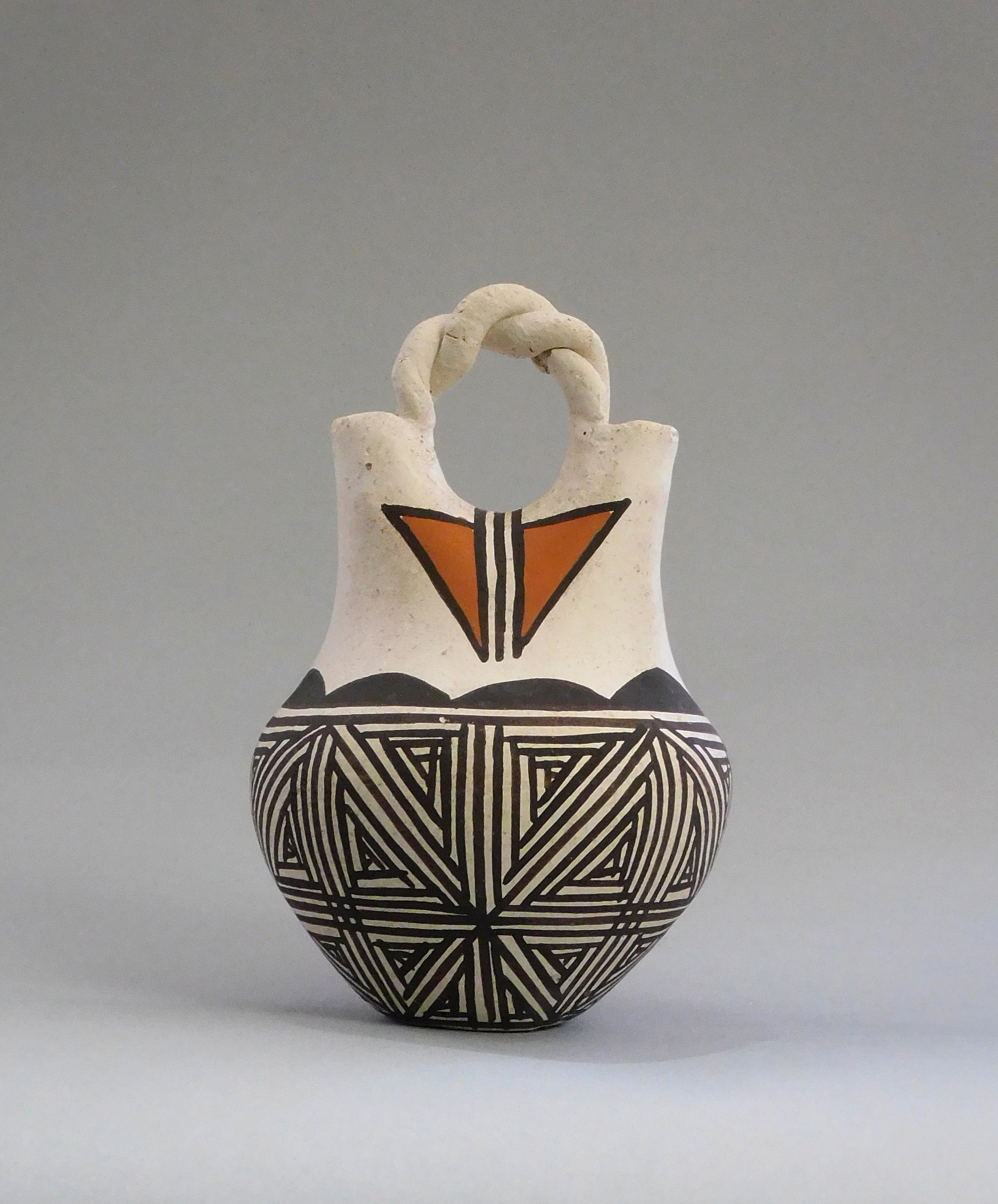 Wedding Vase, Phyllis Leno (Acoma Pueblo), c. 2018, clay, paints, 3 ⅞” x 2 ½”. Cat. no. SAR.2021-1-20. Gift of Susan L. Q. Flaherty. Photo by Susan L. Q. Flaherty.