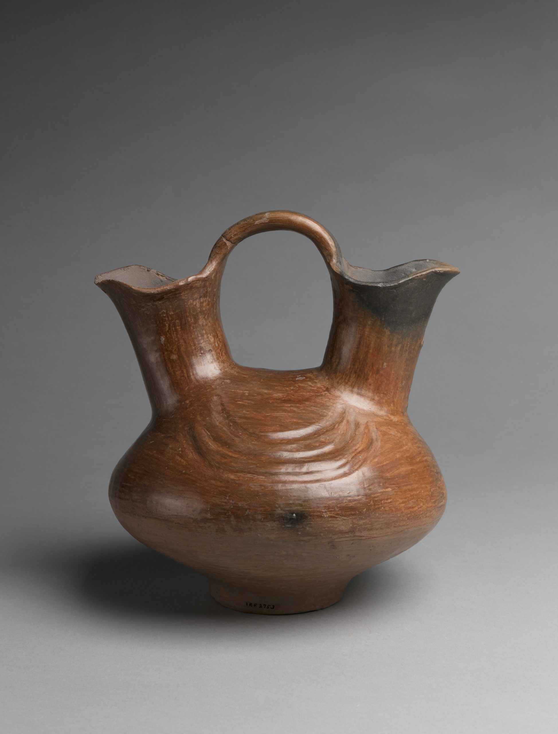Wedding Jar, Artist unknown (Ohkay Owingeh Pueblo), c.1900-1920, clay, 11 ¼” x 24 13/16”. Cat. no. IAF.2753. Photo by Addison Doty.